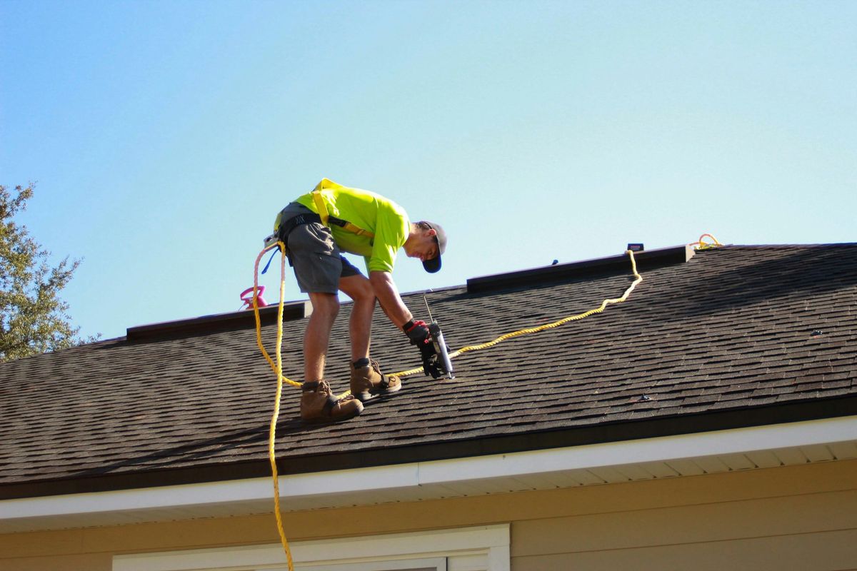 Roofer on a roof
